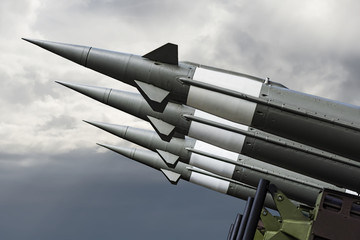 Nuclear Missiles With Warhead Aimed at Gloomy Sky. Balistic Rockets War Backgound. - 125005700