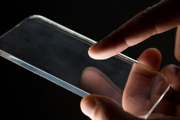 close up of businessman with glass smartphone