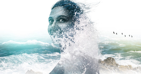 Double exposure portrait of a woman and the sea