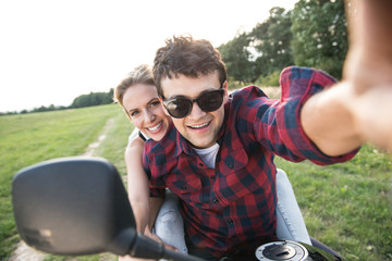 Couple in love enjoying a quad bike ride in countryside. © Halfpoint