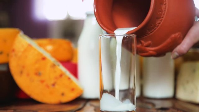 pour the milk into cup from jug