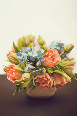 Small bouquet of flowers on dark and white background