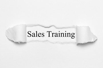 Sales Training on white torn paper