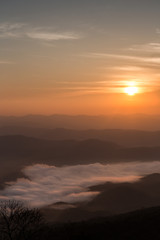 Fototapeta na wymiar Morning sunrise in mountain and sea of fog in Doi Samer Dao Nan province Thailand national park