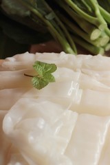 Making rice noodle flat on wood background.