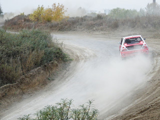 Sports car passes a turn at high speed