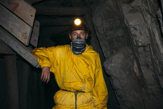 Bolivia, Potosi, tourist wearing protective clothing standing in the Cerro Rico silver mine