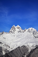 Fototapeta na wymiar Mount Ushba in winter at sun day