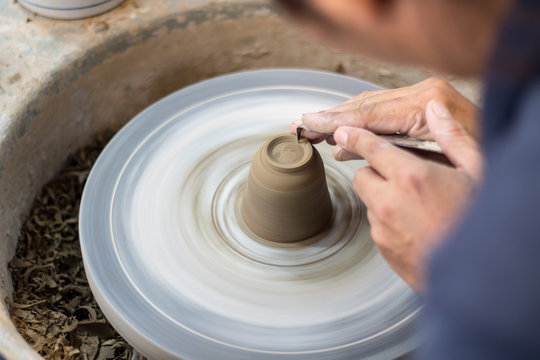 working on pottery wheel