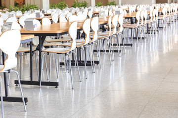 Canteen with white chairs and tables