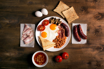 Fototapeta na wymiar English breakfast on a brown wooden table