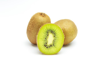 Kiwi fruit on black and wooden plate