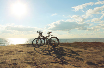Two bicycle at sunset