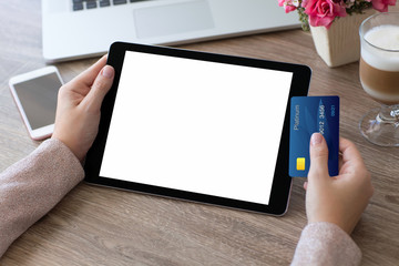 woman hands holding credit card and tablet computer isolated scr