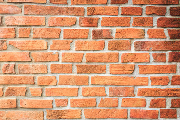 Wall of brown brick block construction, background and pattern