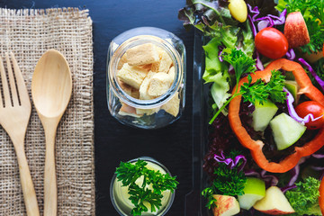 Crispy bread, Kiwi sauce and mix salad with fruit and vegetable