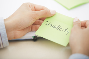 Simplicity text on adhesive note