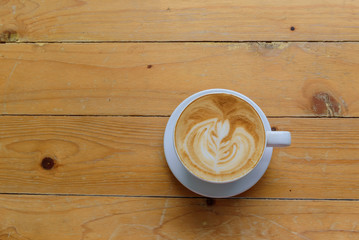 coffee latte art on wood table