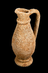 Isolated Ancient Jug on Black Background.