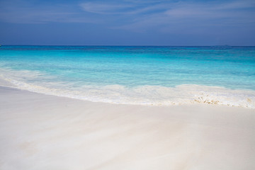 Fototapeta na wymiar Wave of the sea on the sand beach 