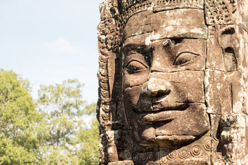 Fototapeta na wymiar Smiling,gargantuan face at Angkor Thom,Siem Reap,Cambodia.
