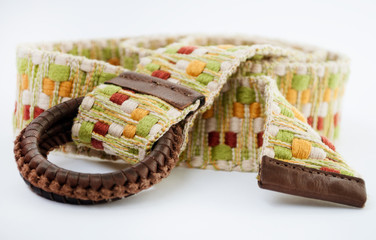 Women's woven belt with leather buckle