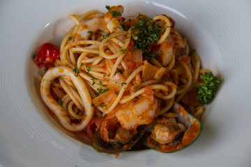spaghetti sea food on white plate.