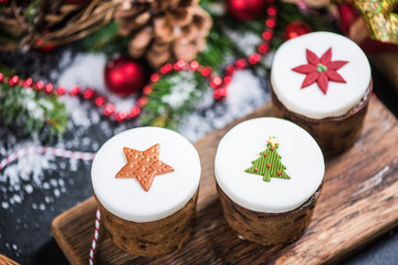 Traditional Christmas fruit rich cakes with decoration