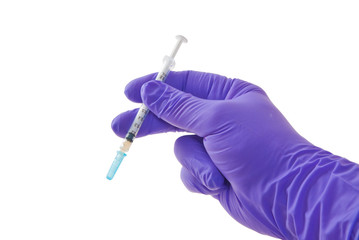 Hand holding syringe isolated on white.