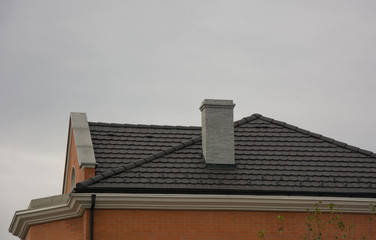 Chimney on the roof of house