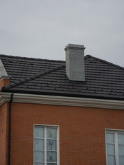 Chimney on the roof of house