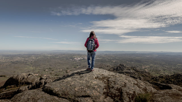 Girl standing on the top of a hill, Alentejo, Protugal