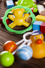 Baby World toy collection on on wooden background