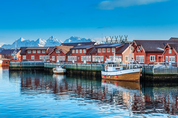 Typical red harbor houses in Svolvaer at early morning. Svolvaer is located in Nordland County on...