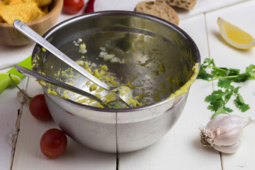 Dirty bowl after preparing guacamole.
