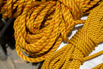 Yellow rope in piles on the market. - Powered by Adobe