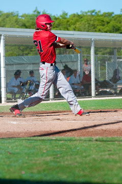American baseball player swinging bat