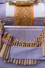 Close-up of artisanal manufacturing tatting. Bobbin lace manufacturing
