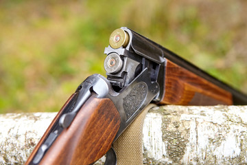 Opened wooden double-barreled hunting gun