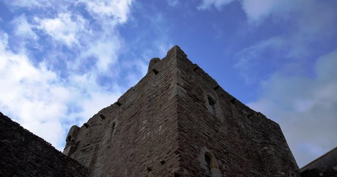 time-lapse of clouds passing over scottish castle tower battlements