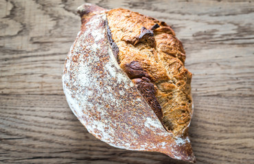 Wholegrain bread on the wooden background