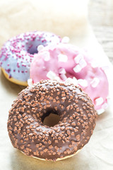 Colourful donuts on the baking paper