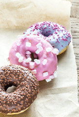 Colourful donuts on the baking paper