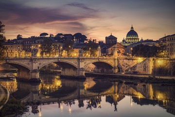 Fototapeta premium St. Peter's cathedral (Basilica di San Pietro) and bridge (Ponte Vittorio Emanuele II) over river Tiber in the evening after sunrise, Rome, Italy, Europe, Vintage filtered style
