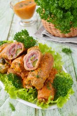 Meat rolls stuffed with bacon and pickled cucumber