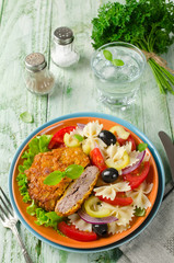 Cornflake crunchy pork cutlets served with pasta salad. Rustic s
