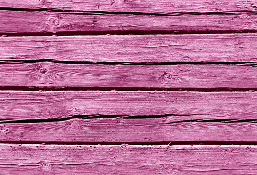 Pink color log house wall.
