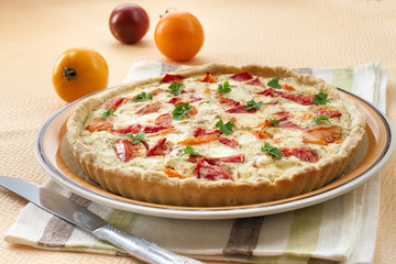 Tart with salted sheep cheese and tomatoes