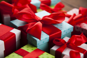 Christmas background with decorations and gift boxes on wooden 