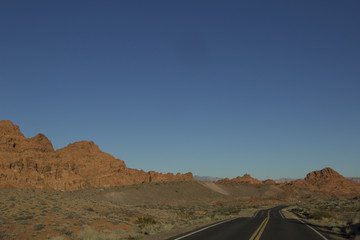 Landscape image of the highway winding and twisting through the Valley of Fire State Park outside of Las Vegas, Nevada.